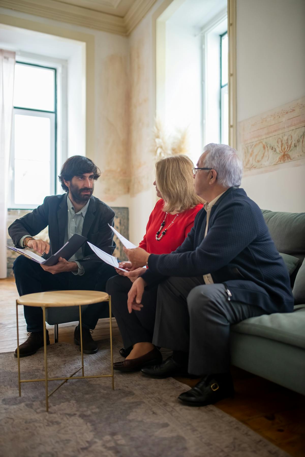 A planner walking a client through their plan in a relaxed home setting.